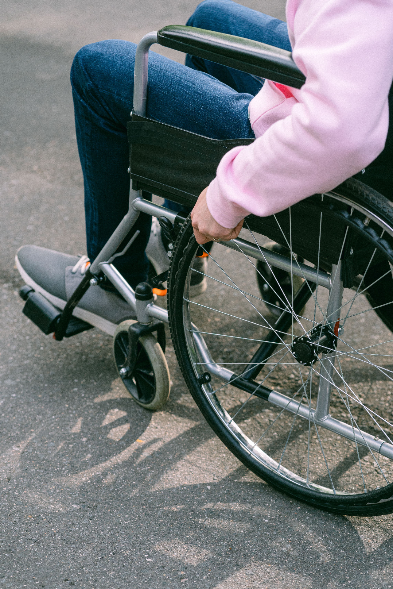 Resident using a wheelchair independently outdoors